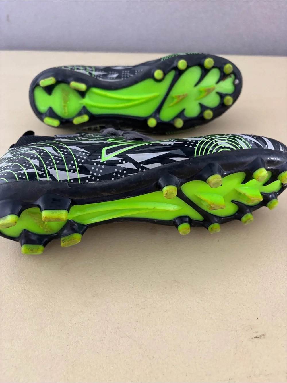 Kids' Black Soccer Cleats with Neon Green Accents